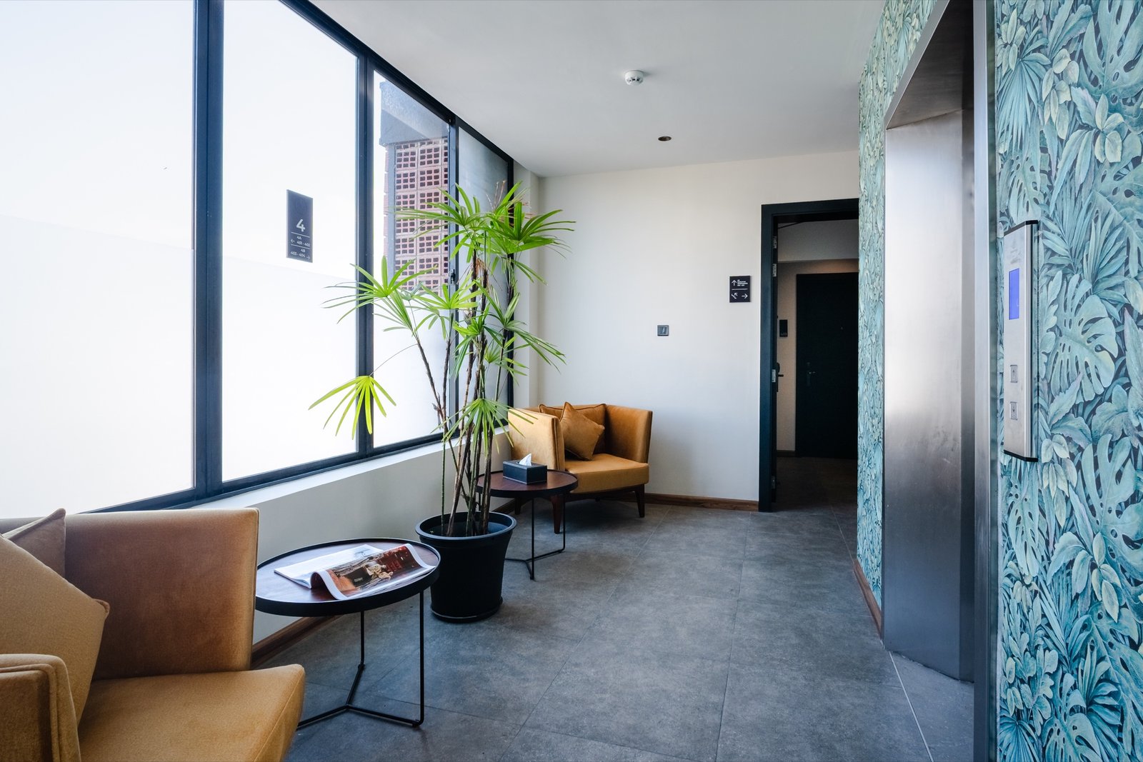 Bright guest corridor and seating at MK Colombo